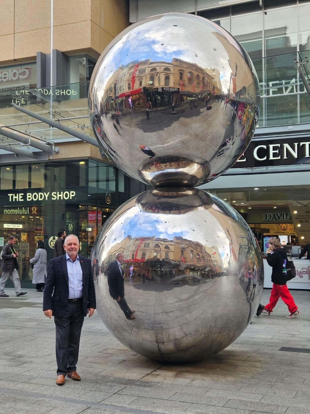 Colin Shearing beside the Rundle Mall spheres